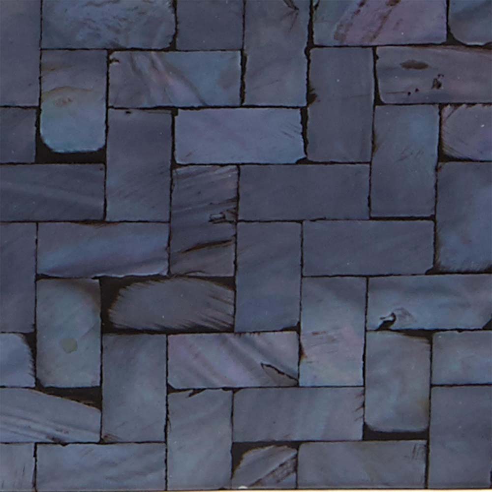 Close up image of dark blue mother of pearl inlay 