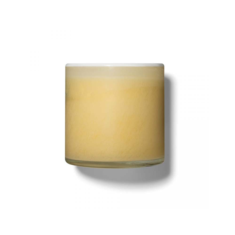 Lafco brand lemon verbena yellow glass candle on a white background
