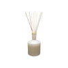 Lafco brand white glass feu de bois reed diffuser on a white background