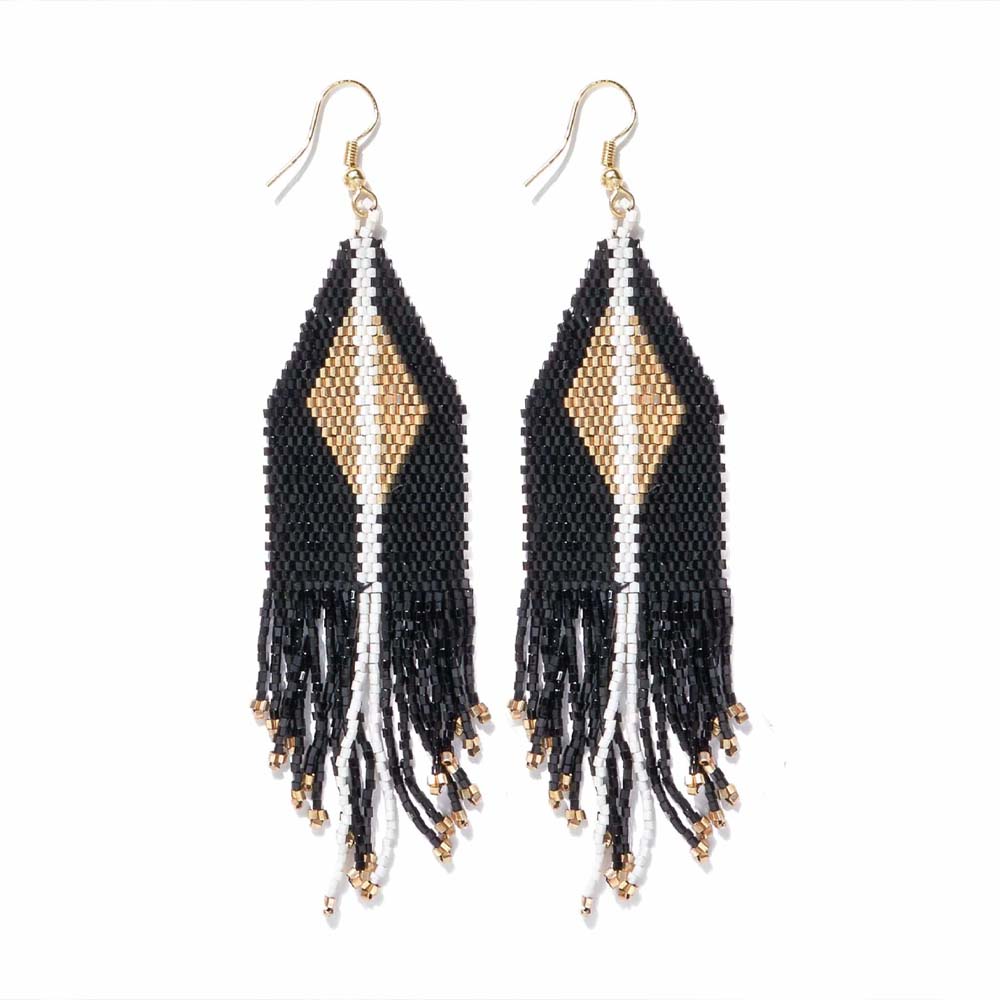 Ink and alloy brand black and gold beaded earrings on a white background