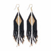 Ink and alloy brand black and gold beaded earrings on a white background