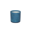 Lafco amber scented blue glass candle on a white background