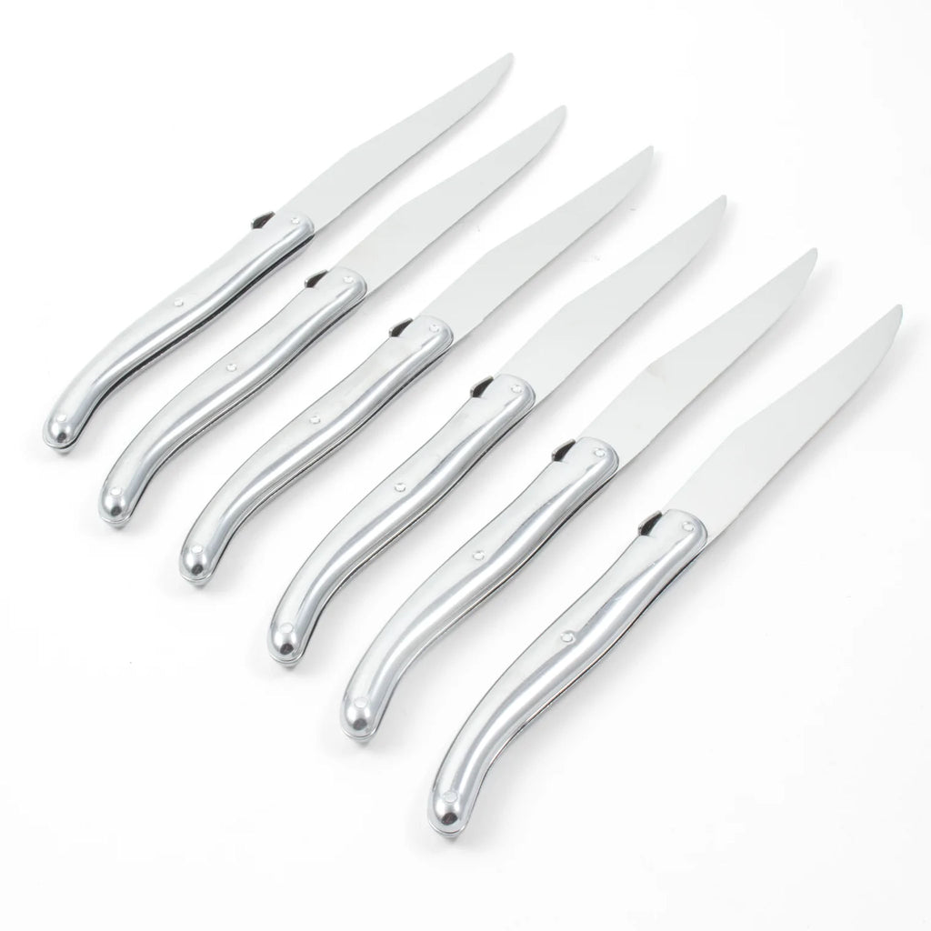 Set of six Laguiole platine made in France stainless steak knives on a white background