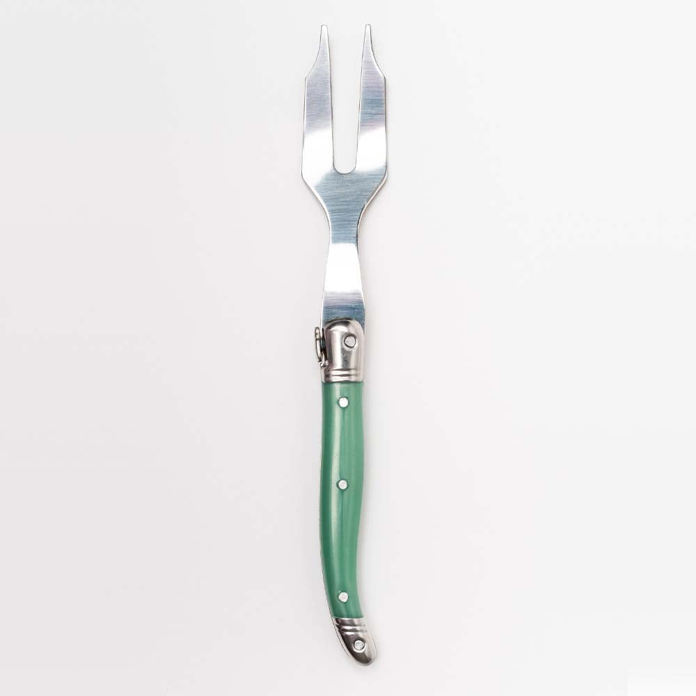 Green Laguiole cheese fork on a white background