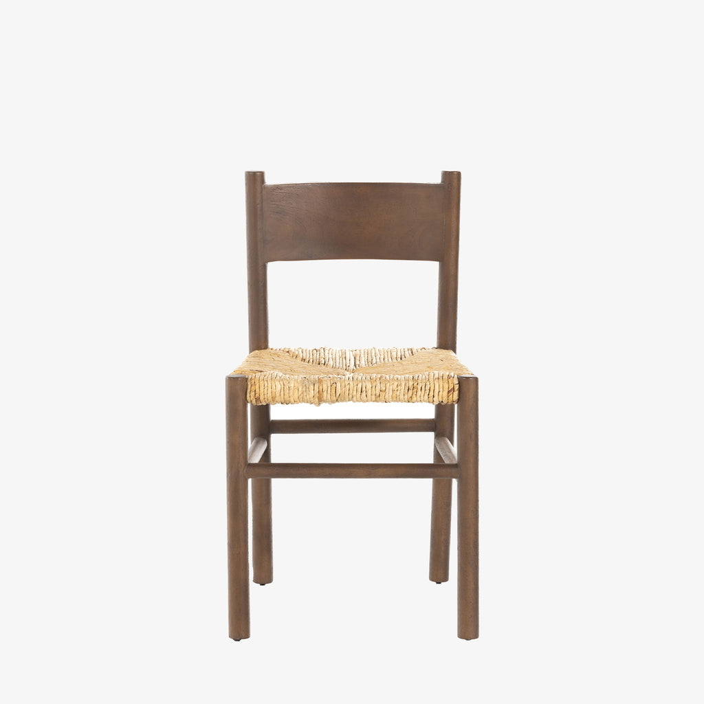 Close up of rush seat on wood 'Largo' dining chair in russet mango by four hands furniture on a white background