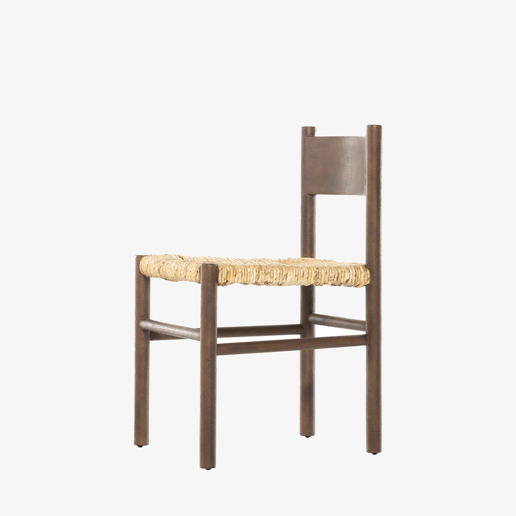 Close up of rush seat on wood 'Largo' dining chair in russet mango by four hands furniture on a white background