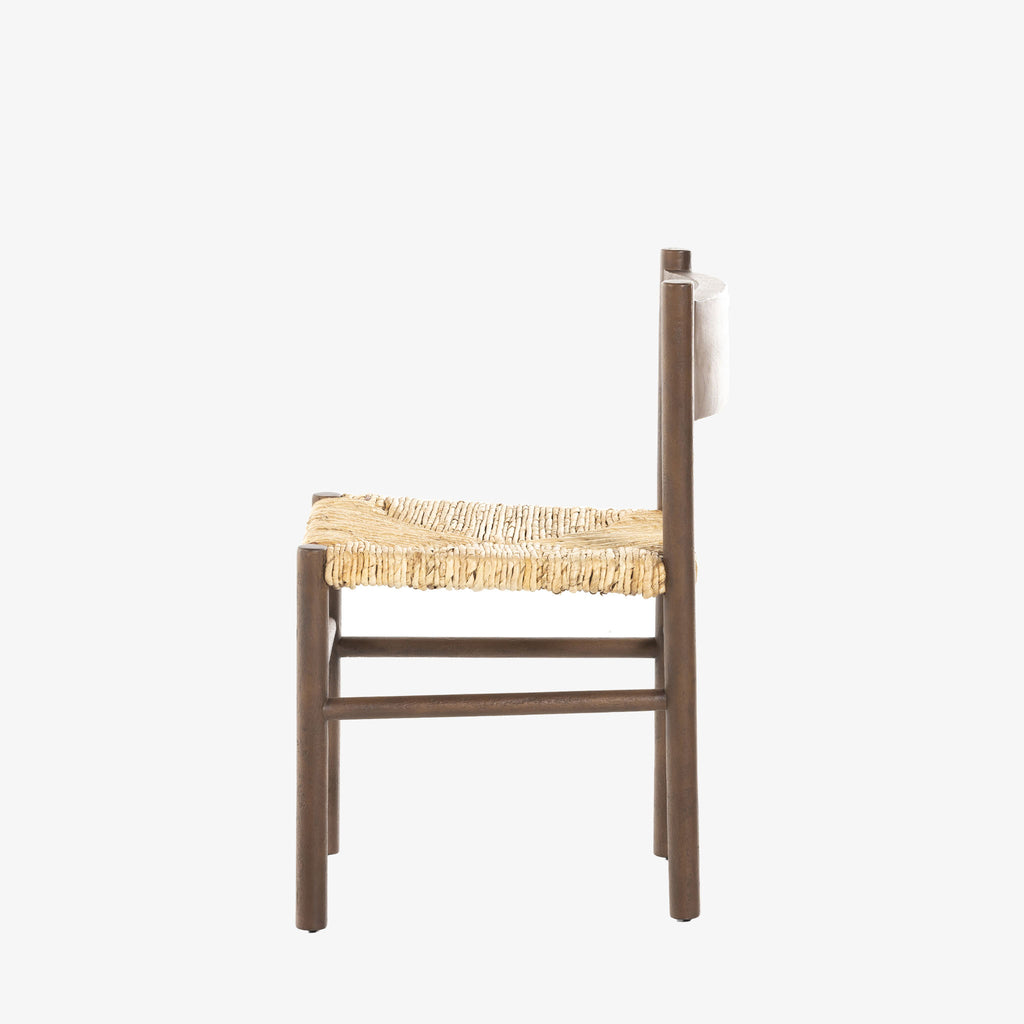 Close up of rush seat on wood 'Largo' dining chair in russet mango by four hands furniture on a white background