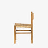 Light wood 'Largo' dining chair in sun-dried mango with rush seat by four hands furniture on a white background