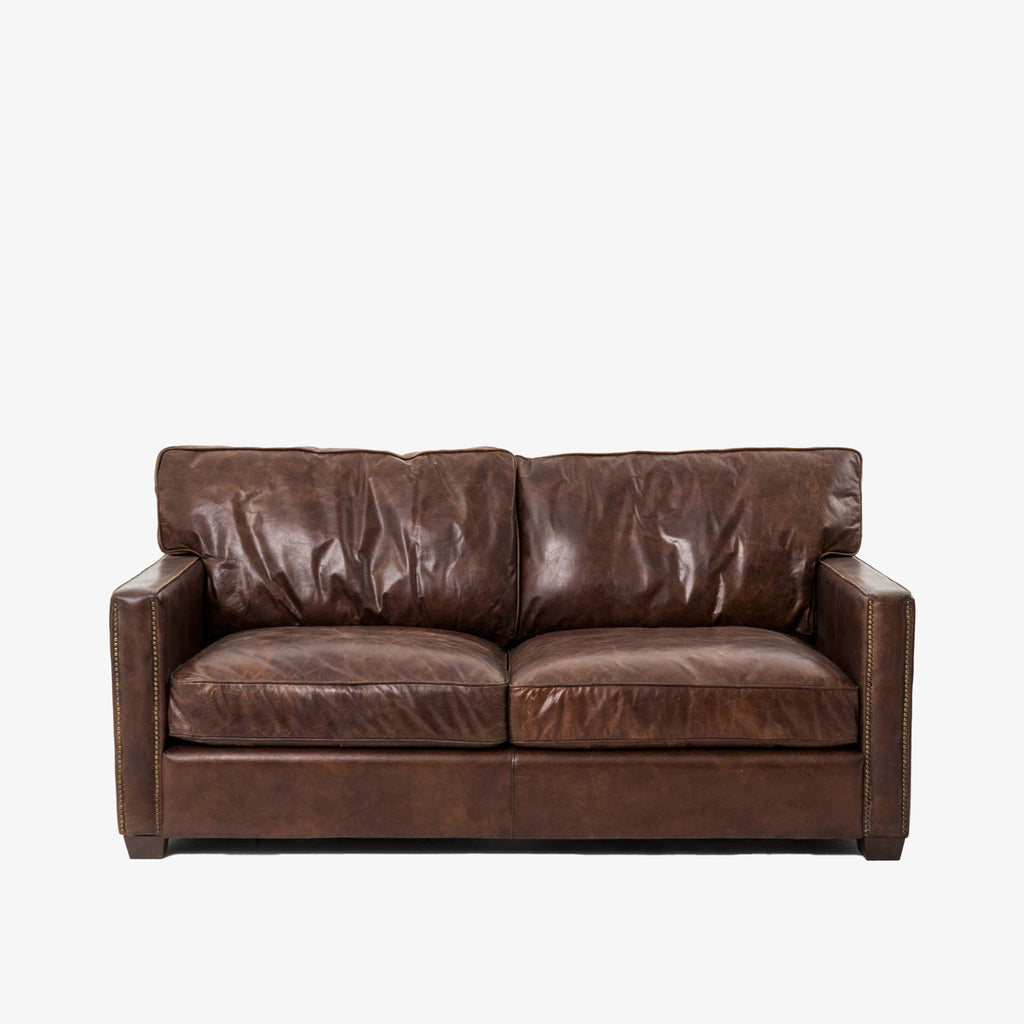 Four hands brand brown leather Larkin 72 inch sofa  on a white background