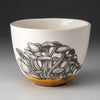Laura Zindel funnel cap mushroom bowl with amber base on a grey background