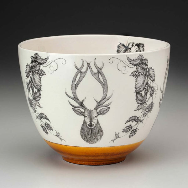 Laura Zindel Medium Red Stag bowl with amber accent glaze on a grey background