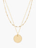Able jewelry gold layered necklace with two chains and circle pendant on white background