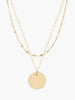 Able jewelry gold layered necklace with two chains and circle pendant on white background