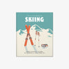 Front cover of book titled 'The Little Book of Skiing' with mountains and blue skies and skis on the cover on a white background