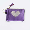 Small zippered purple leather pouch with heart appliqué
