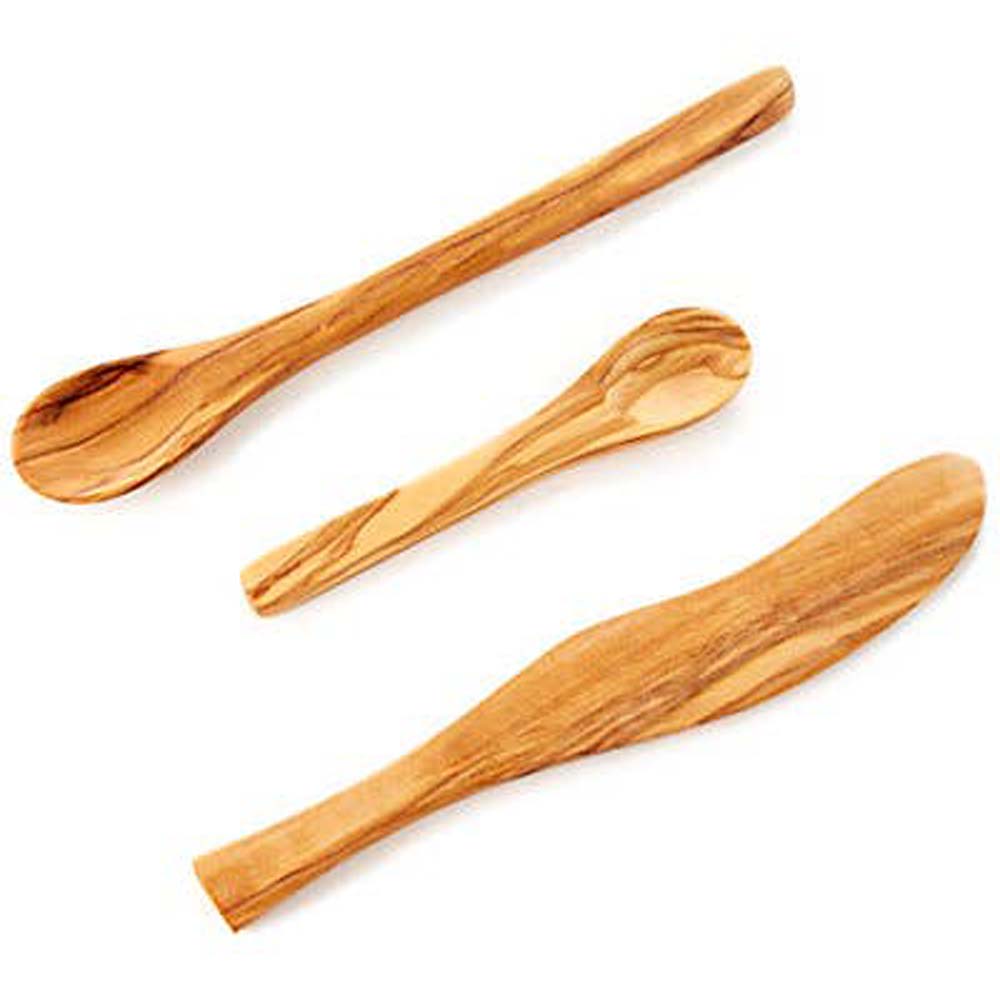 Solid olivewood jam spoon  with other olive wood items on a white background
