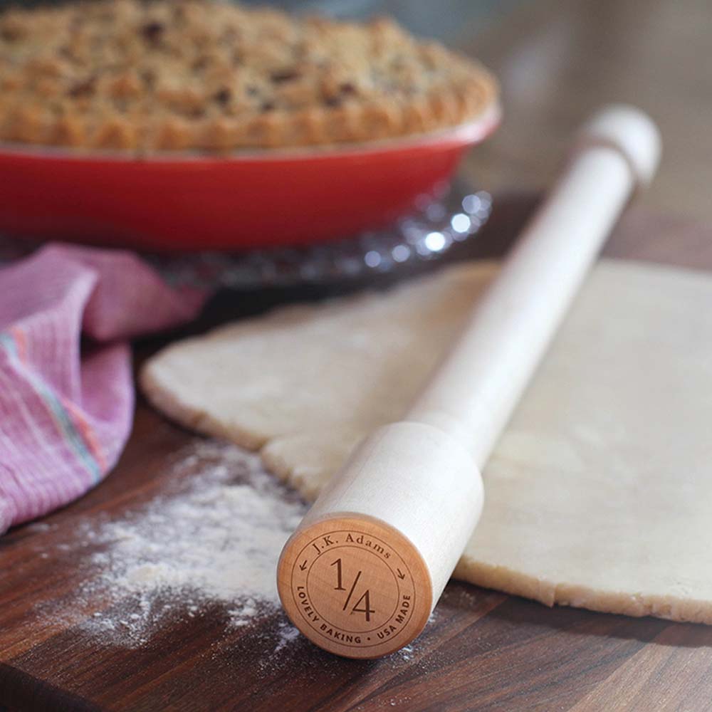 JK Adams lovely rolling pin on a wood surface with dough and pie in the background
