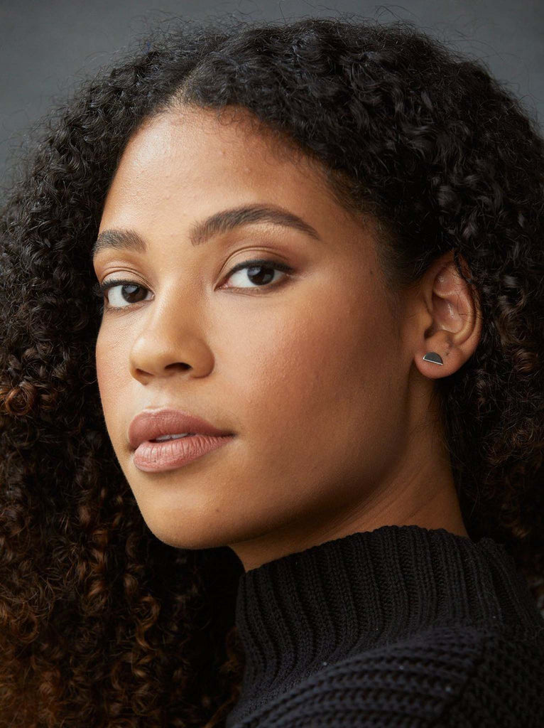 Model wearing Able brand Luna studs in sterling silver 