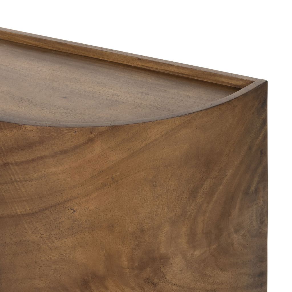 Close up of Curved wood 'Lunas' sideboard with small steel feet  by four hands furniture on a white background