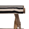 Close up of Foldable stool with wood frame and striped canvas seat