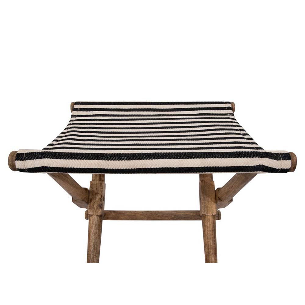 Fabric seat close up of foldable stool with wood frame and striped canvas seat