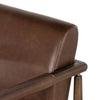 Brown leather 'Markia' arm dining chair with wood frame by four hands furniture on a white background