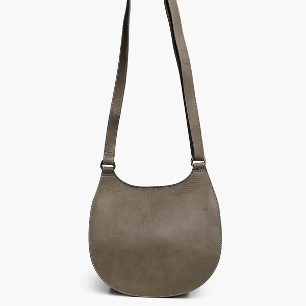Able brand Martha saddle bag in slate color with adjustable shoulder strap on a white background