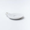 Large white marble dish with handle on a white background