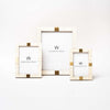 Three white bone inlay picture frames with gold accents in three sizes on a white background