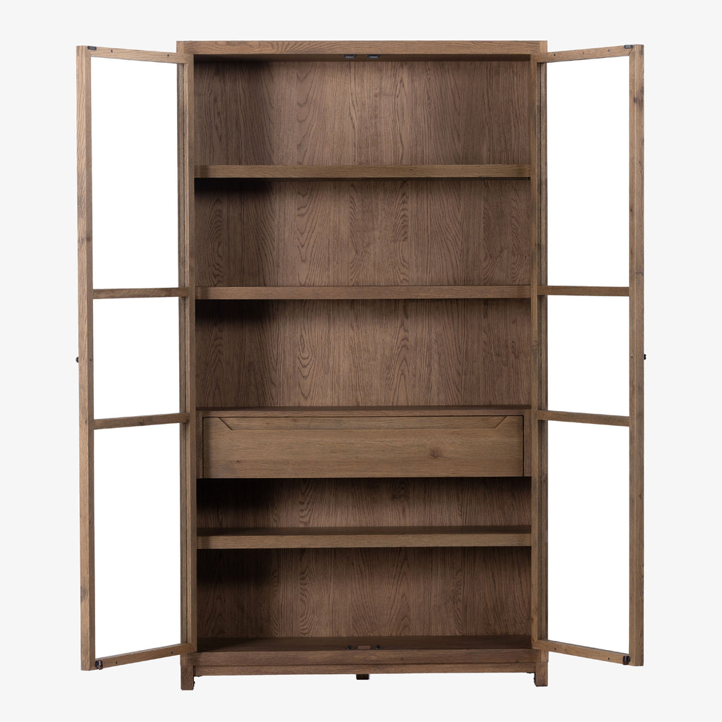 Four hands furniture brand Millie oak cabinet with glass doors and four shelves and interior drawer on a white background with doors open