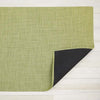 Chilewich mini basketweave woven floor mat in green dill color on light wood floor 