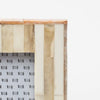 Close up of Small white and wood picture frame on a white background