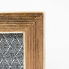 Close up of Mango wood picture frame with cream border on a white backgroun