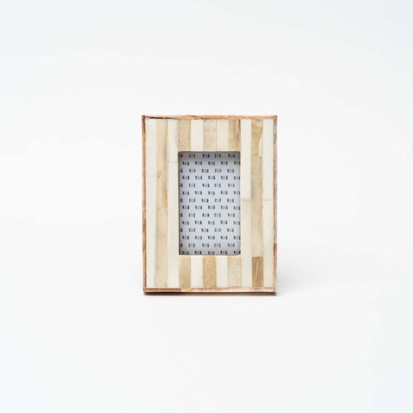 Small white and wood picture frame on a white background