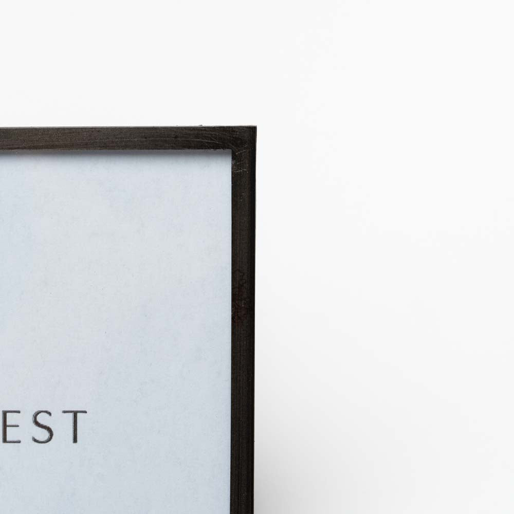 Close up of Metal easel style 4x6 picture frame on a white background