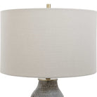 Close up of Moynahan Table Lamp on an end table in a living room at Addison West on a white background at Addison West