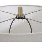 Close up of Moynahan Table Lamp on an end table in a living room at Addison West on a white background at Addison West