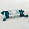Mer Sea brand moroccan mint aromatherapy eye pillow in blue velvet with tassels on white background