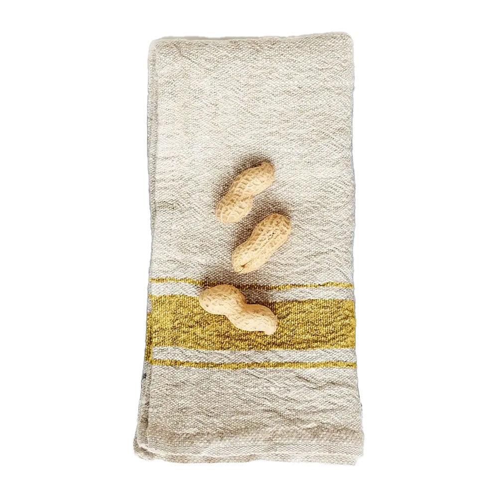 Natural linen napkin with mustard yellow stripe on a white background