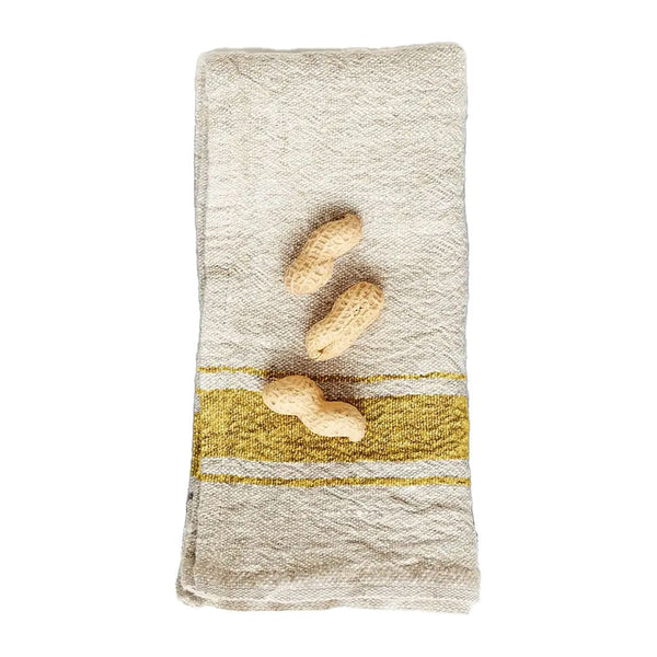 Natural linen napkin with mustard yellow stripe on a white background
