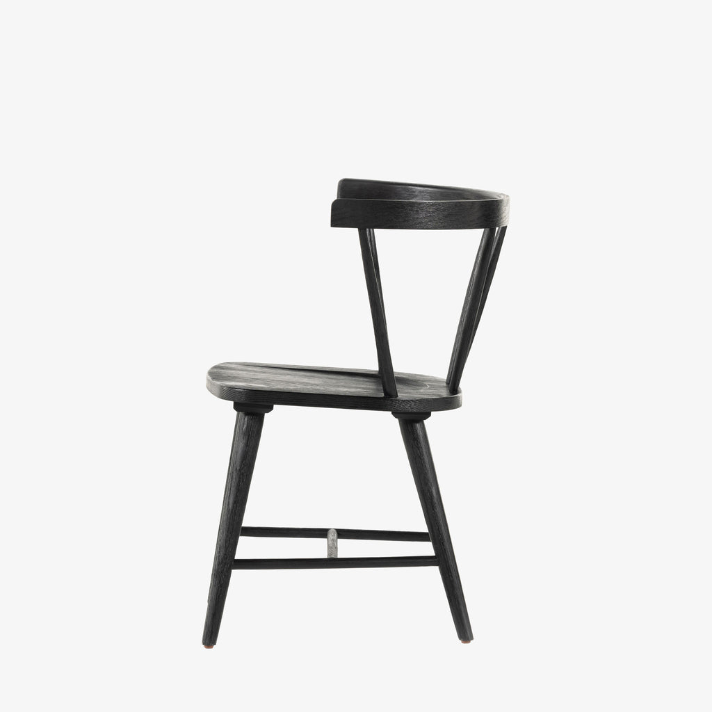 Black 'Naples' Windsor style dining chair with wrap around back and round tenoned back by four hands furniture on a white background