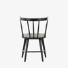 Black 'Naples' Windsor style dining chair with wrap around back and round tenoned back by four hands furniture on a white background