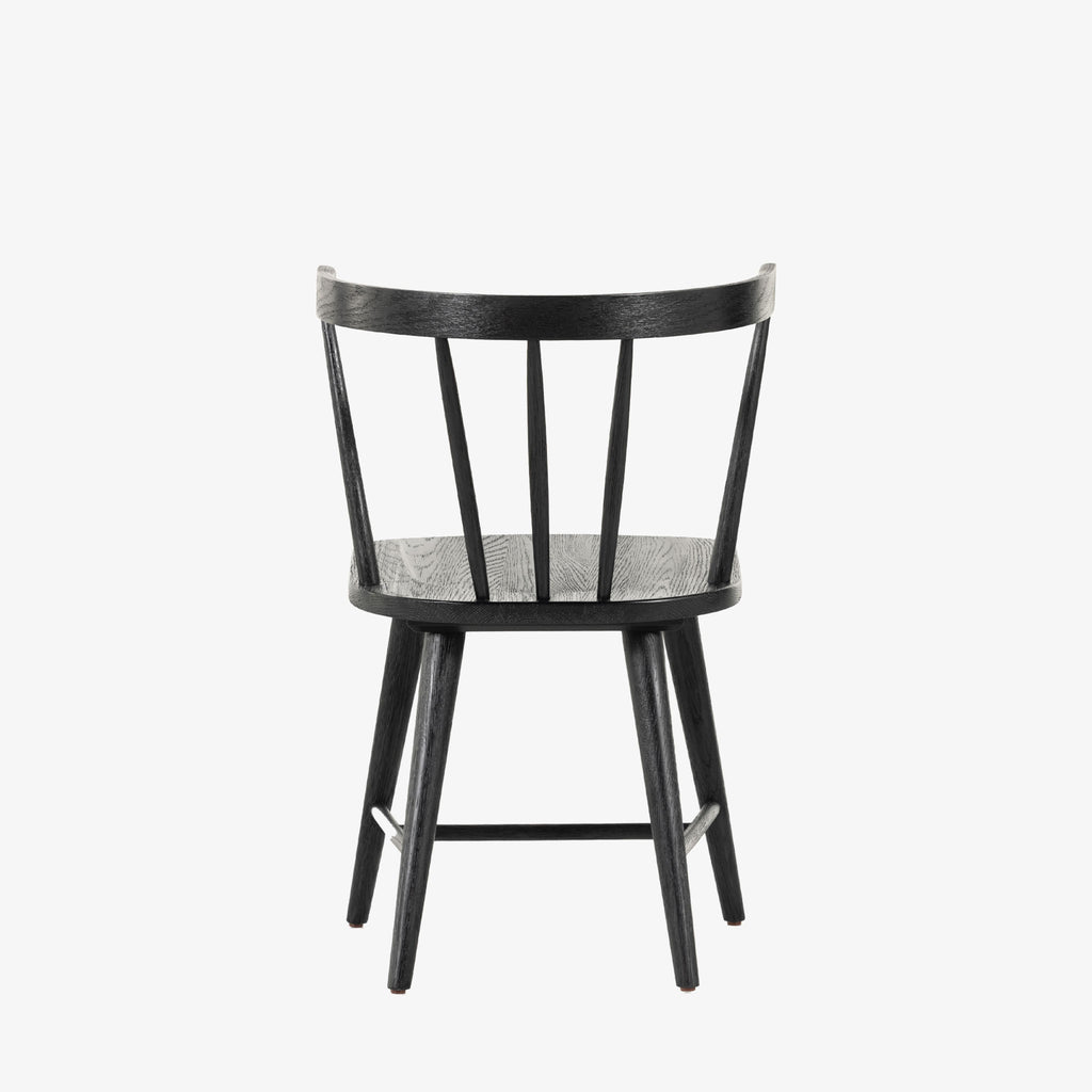 Black 'Naples' Windsor style dining chair with wrap around back and round tenoned back by four hands furniture on a white background