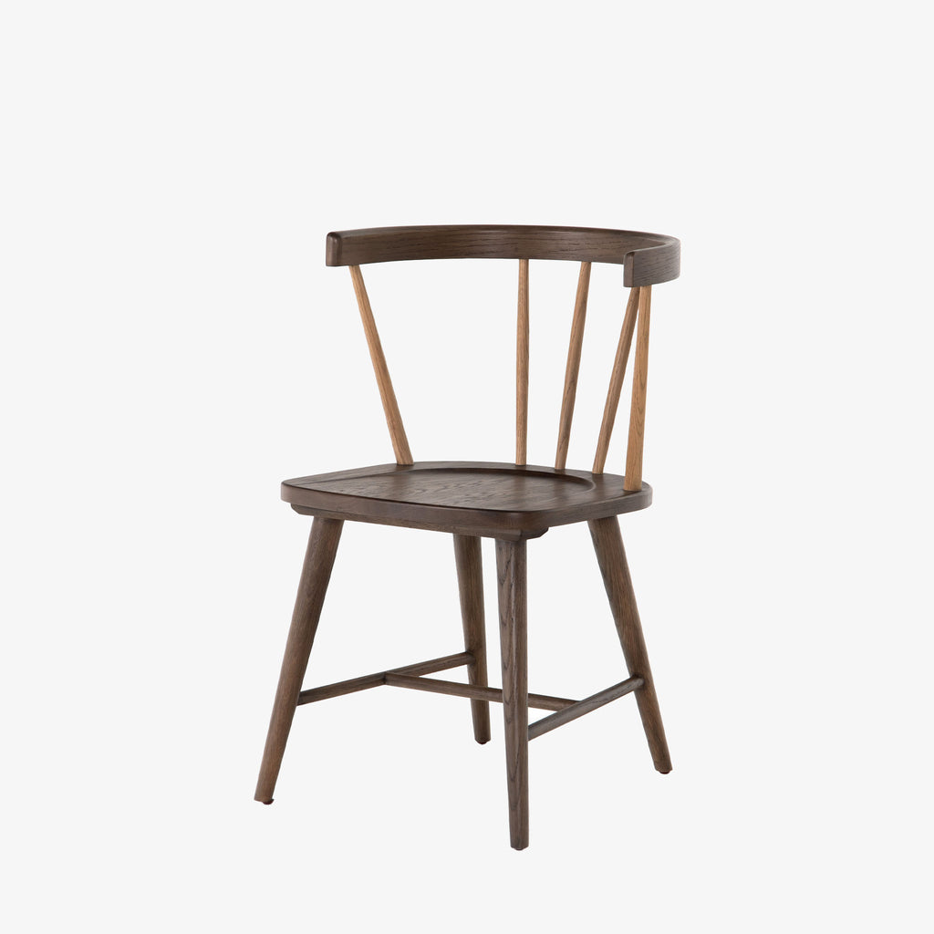 Brown oak 'Naples' Windsor style dining chair with wrap around back and round tenoned back by four hands furniture on a white background
