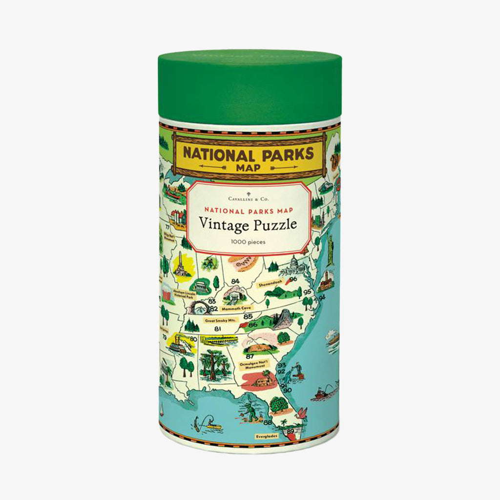 Cavallini paper national parks map puzzle in cardboard tube on a white background
