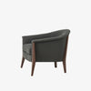 Grey upholstered 'nomad' arm chair by Four Hands Furniture with dark wood frame and rounded back on a white background
