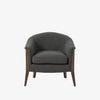 Grey upholstered 'nomad' arm chair by Four Hands Furniture with dark wood frame and rounded back on a white background
