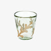 Glass votive holder with gold painted leaf design on a white background