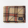 Johnson Woolen Mills wool blanket in brown, black and beige check print on a white background