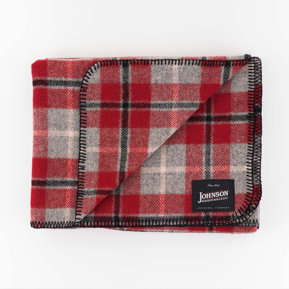 Johnson Woolen Mills wool blanket in grey and red check print on a white background
